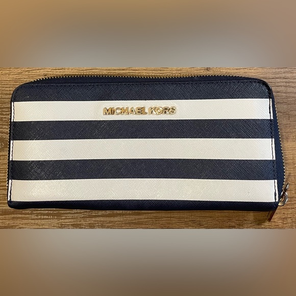 Michael Kors Collection Handbags - Michael Kors navy and white stripped wallet normal wear.